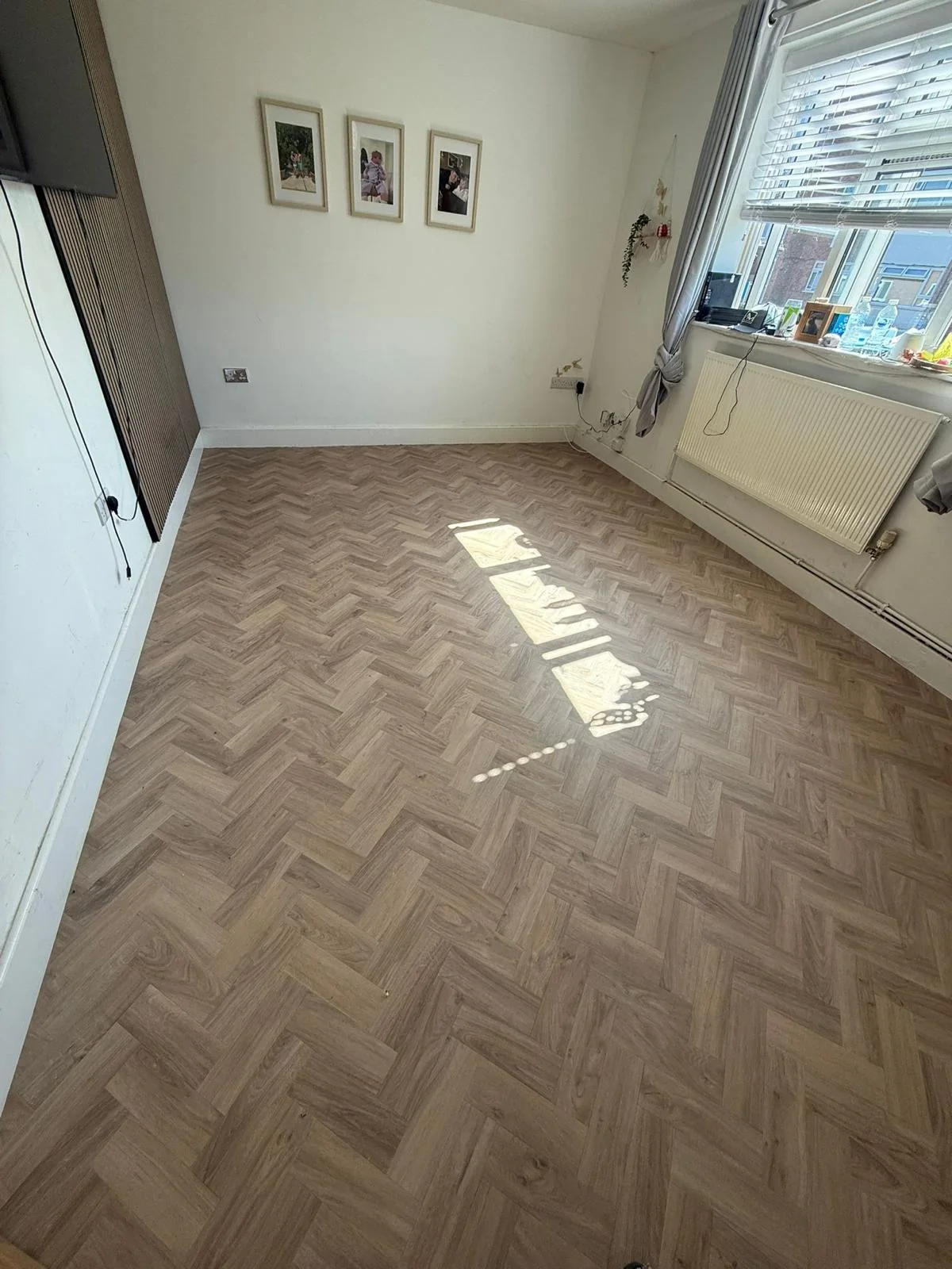 Finished herringbone flooring in a bright living room